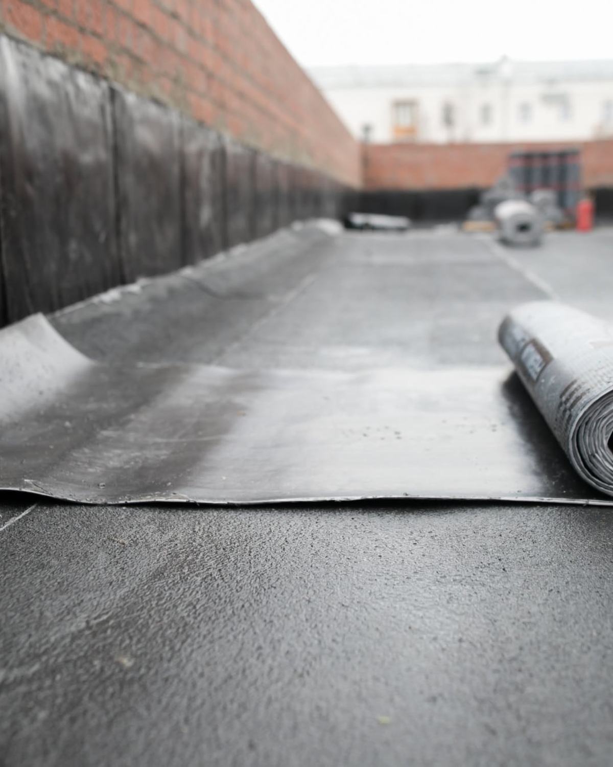Roll of EPDM on a commercial roof (stock; card Rubber Roof)